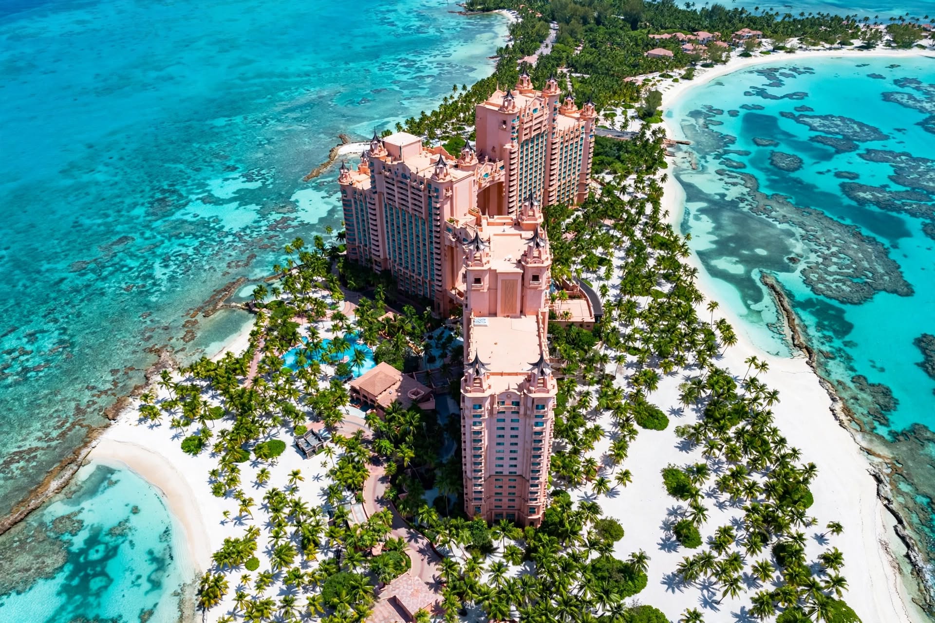 Aerial view of Atlantis Paradise Island Royal Towers flanked by turquoise ocean waters