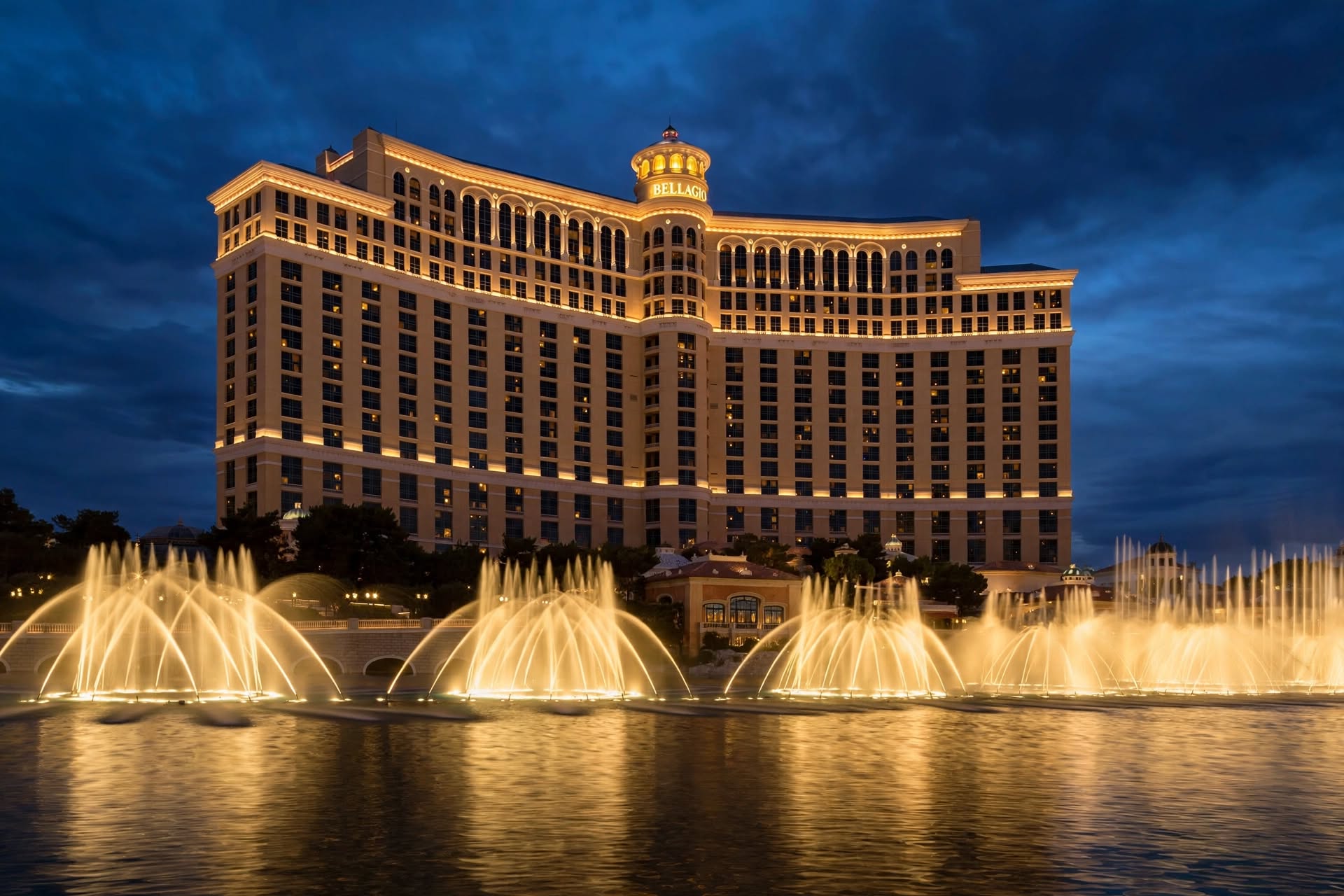 Illuminated exterior view of Bellagio fountains and tower at night